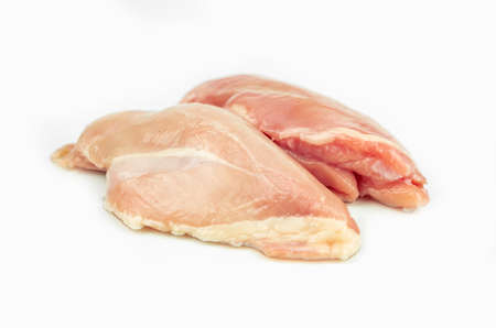 piece of chicken breast, raw filet meat, isolated on whiteの写真素材