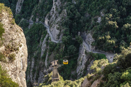 Montserrat mountain rocks and monastery near Barcelona. Rope Trainの写真素材