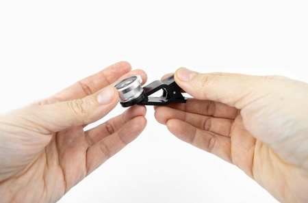 Phone photo lens with clips on white background. Extra macro camera for smartphoneの写真素材