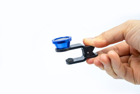 Phone photo lens with clips on white background. Extra macro camera for smartphone. Set of lenses...