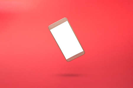White 3d smartphone with empty copy space against red background. 3D illustration design template background. Top mobile phone message. Advertisement idea. Blank copy space for ad.の写真素材