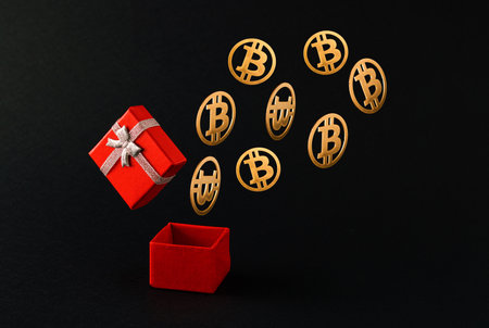 Open gift box with bitcoins flying on a black background. Price surprise concept. Mining or blockchain technology for cryptocurrency concept. Abstract 3D illustration Background Art.の写真素材