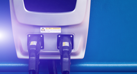 Double headed electric vehicle charging pile