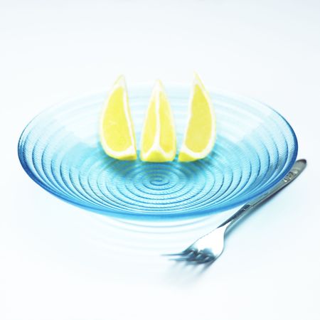 lemons in blue bowlの写真素材