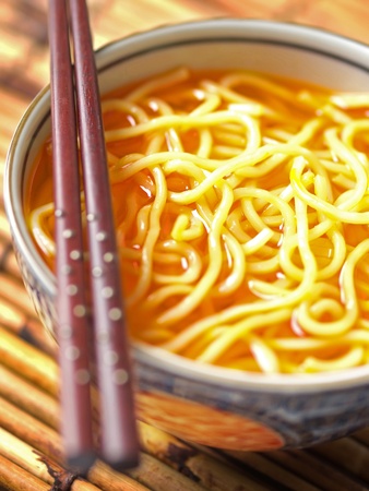 asian yellow noodles in chili oilの写真素材