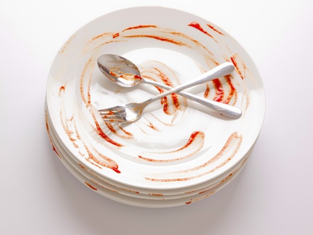 close up of a stack of dirty platesの写真素材