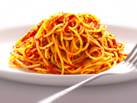 close up of a plate odf spaghetti noodles in tomato sauceの写真素材