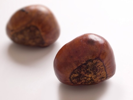 close up of roasted chestnuts on whiteの写真素材