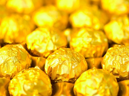 close up of candy in gold wrappersの写真素材