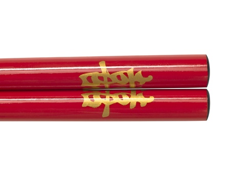 close up of double happiness red chopsticks isolated on whiteの写真素材