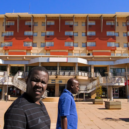 gaborone, botswana, africa  october 2nd, 2013: pedestrians at the main mall shopping and dining area in gaborone.のeditorial素材