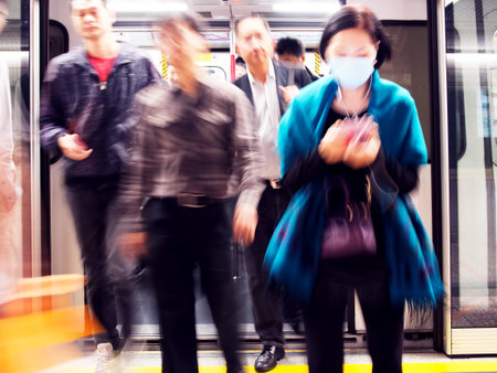 HONG KONG - November 8 2014 : Passengers exiting MTR subway cabin. Over 90% daily travelers use public transport.のeditorial素材
