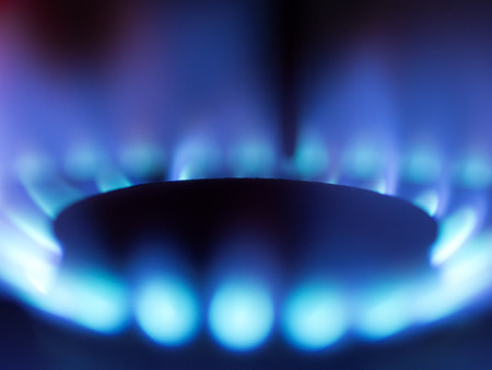 close up of a gas stove blue flame