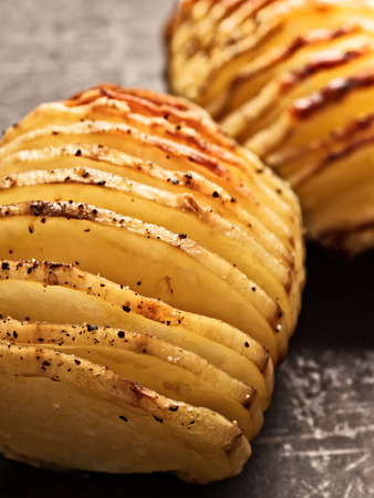close up of rustic roasted hasselback potato gratinの写真素材