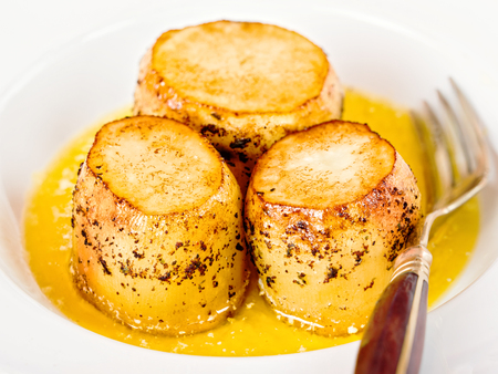 close up of golden fondant potatoの写真素材