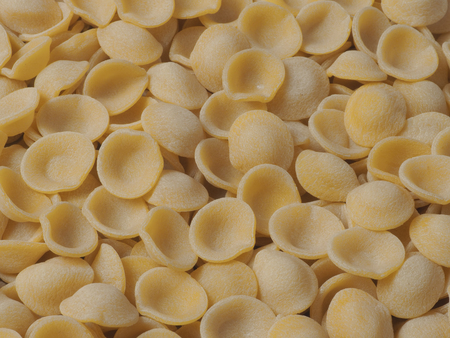 close up of dried italian orecchiette pasta food backgroundの写真素材