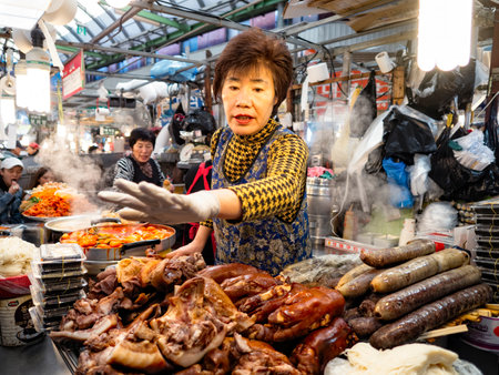 gwangjang market, south korea - 11th november 2017: traditional jokbal braised pork trotters and sundae sausage street vendor at at gwangjang marketのeditorial素材