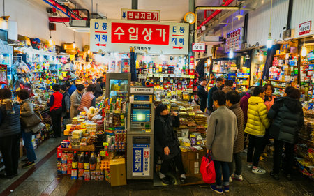 seoul, south korea - 11th november 2017: crowds at the  colorful traditional grocery market selling...