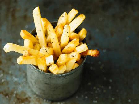 close up of rustic golden french friesの写真素材