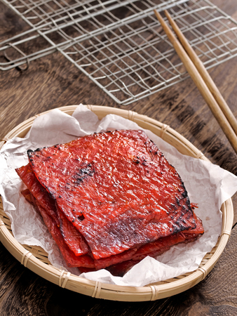 close up of a basket of chinese pork jerkyの写真素材