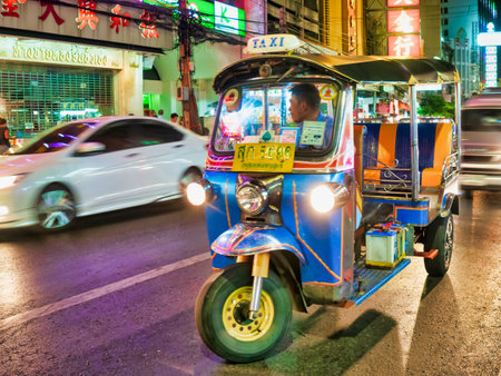Bangkok, Thailand, 3rd January 2019, Tuk - tuk in Bangkok Chinatown at night. They contribute to the...