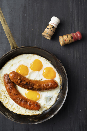 close up of rustic american sausage and eggs breakfastの写真素材