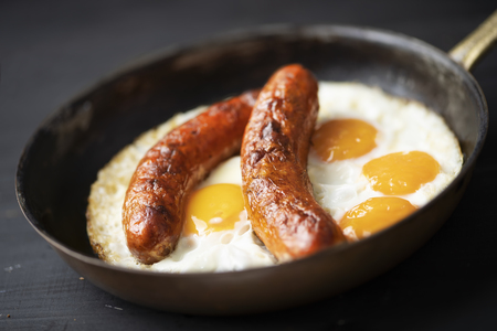 close up of rustic american sausage and eggs breakfastの写真素材