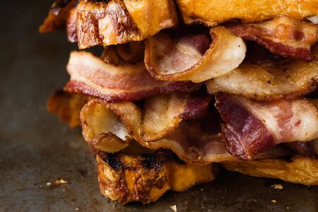 close up of rustic english bacon butty sandwich