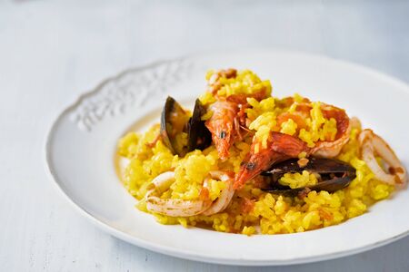 close up of rustic spanish seafood paella の写真素材