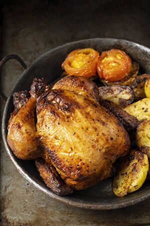 close up of rustic golden roasted whole chickenの写真素材