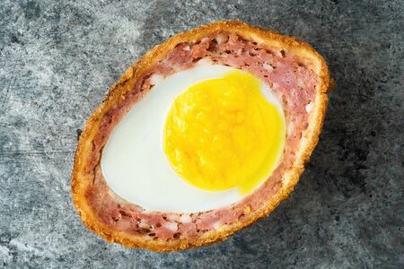 close up of rustic traditional english comfort pub food scotch egg