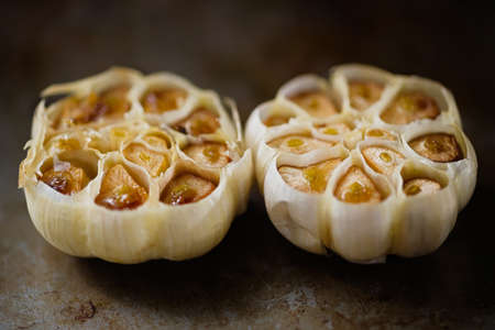 close up of rustic roasted baked garlicの写真素材