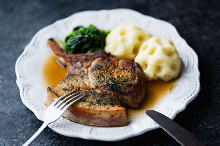 close up of rustic golden  caramelized pork chop