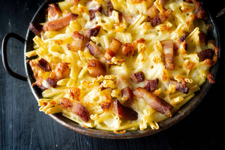 close up of pan of rustic italian american baked cheesy ziti pastaの写真素材
