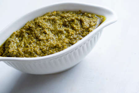 close up of a bowl of basil pesto sauceの写真素材