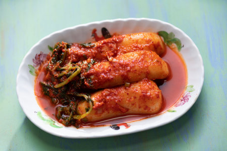 close up of a plate whole radish kimchi, chonggak kimchi