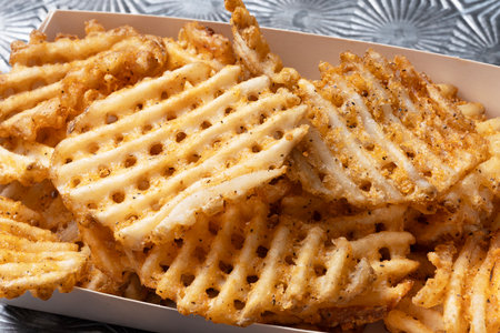 close up of rustic  golden waffle crosscut potatoes