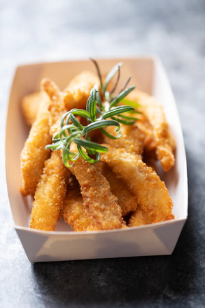 Close up of rustic pan fried breaded chicken tendersの写真素材