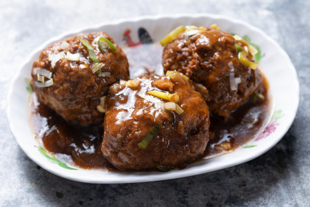 close up of a plate of chinese traditional braised lion's head meat ballの写真素材