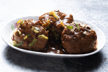 close up of a plate of chinese traditional braised lion's head meat ballの写真素材