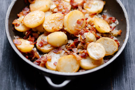 close up of traditional german pan-fried potatoes bratkartoffelnの写真素材