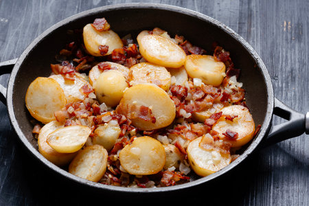 close up of traditional german pan-fried potatoes bratkartoffelnの写真素材