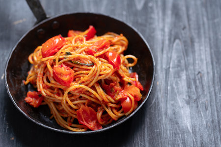 close up of a pan of traditional spaghetti in tomato sauceの写真素材