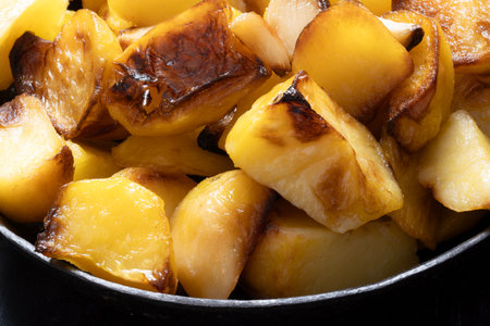 close up of a pan of rustic italian roast potatoesの写真素材