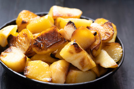 close up of a pan of rustic italian roast potatoesの写真素材