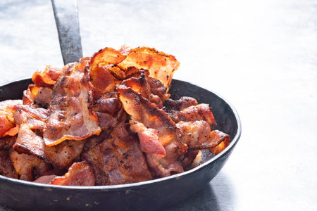 close up of a rustic pan of bacon rashes