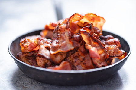 close up of a rustic pan of bacon rashes