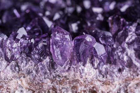Amethyst geode on black background. Beautiful natural crystals gemstone. Extreme close up macro shot.の写真素材