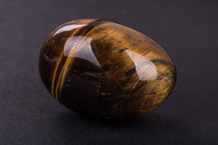 Tiger Eye geode on black background
