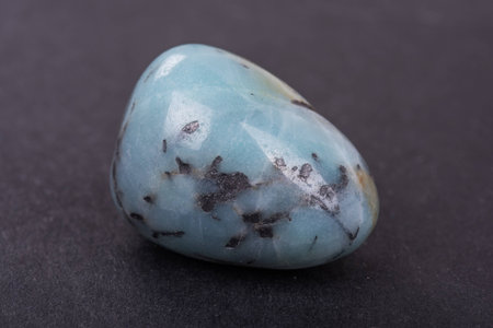 Amazonite geode on black background. Beautiful natural crystal gemstone.